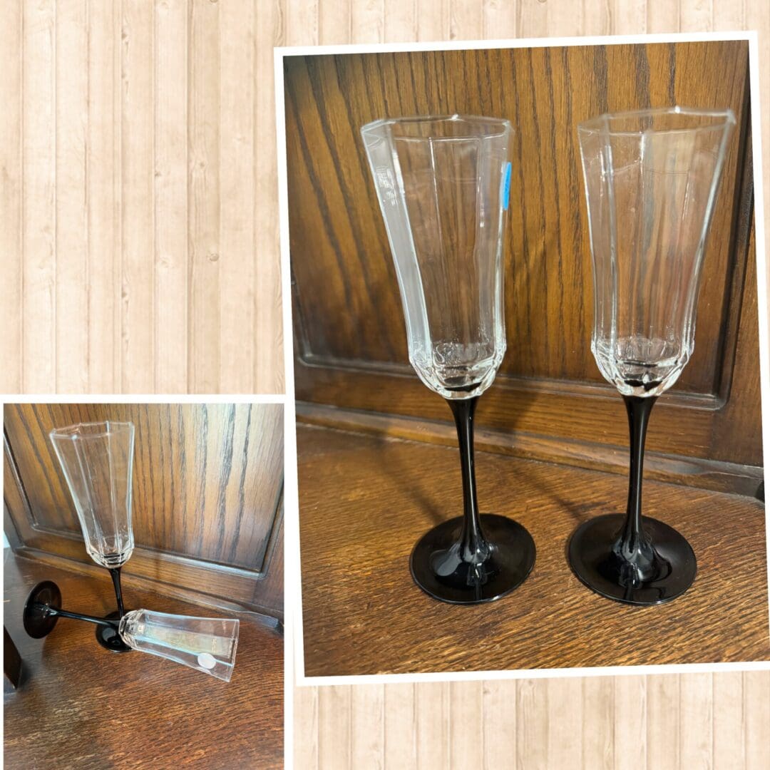 A couple of glasses sitting on top of a wooden table.