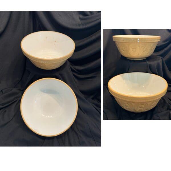 A bowl and plate set with gold trim.