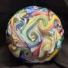 A ball with swirls of colors on it