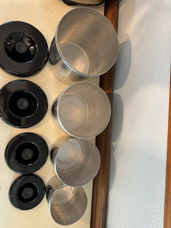 A close up of cups and bowls on the counter