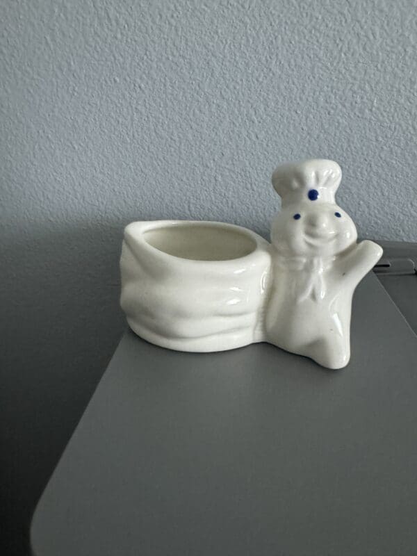 A white ceramic dish with a person on it.