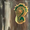 A close up of the badge on a glass