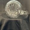 A glass vase sitting on top of a table.