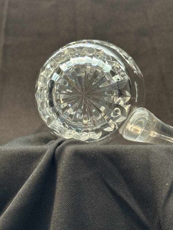 A close up of a glass bottle on top of a table