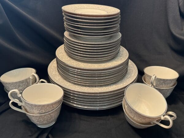 A stack of plates and cups on top of each other.