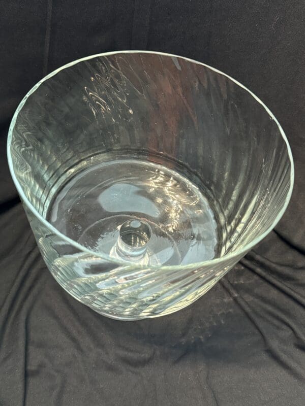 A glass cup sitting on top of a table.