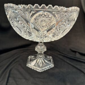 A glass bowl sitting on top of a table.