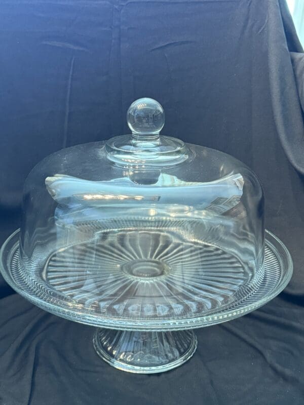 A glass cake plate with a dome lid.