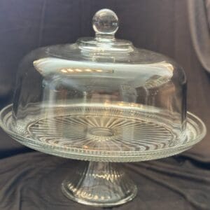 A glass cake plate with a dome lid.