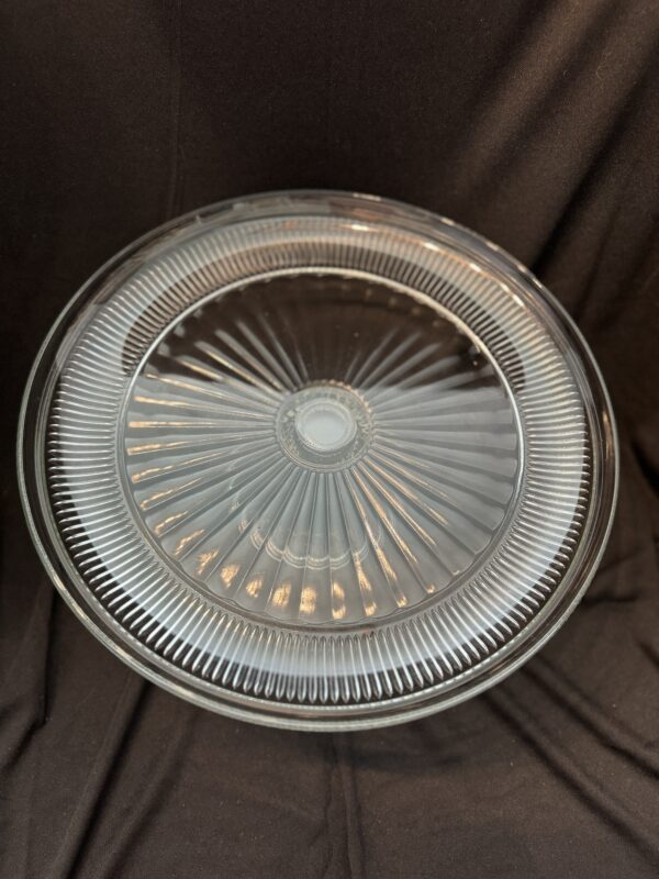 A glass plate with a lid on top of it.