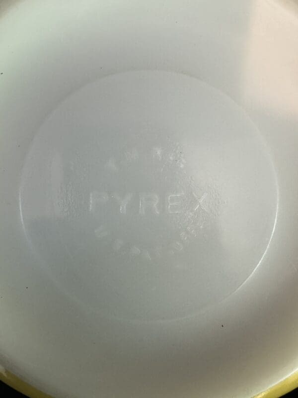 A white plate with the word pyrex written on it.