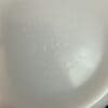 A white plate with some writing on it
