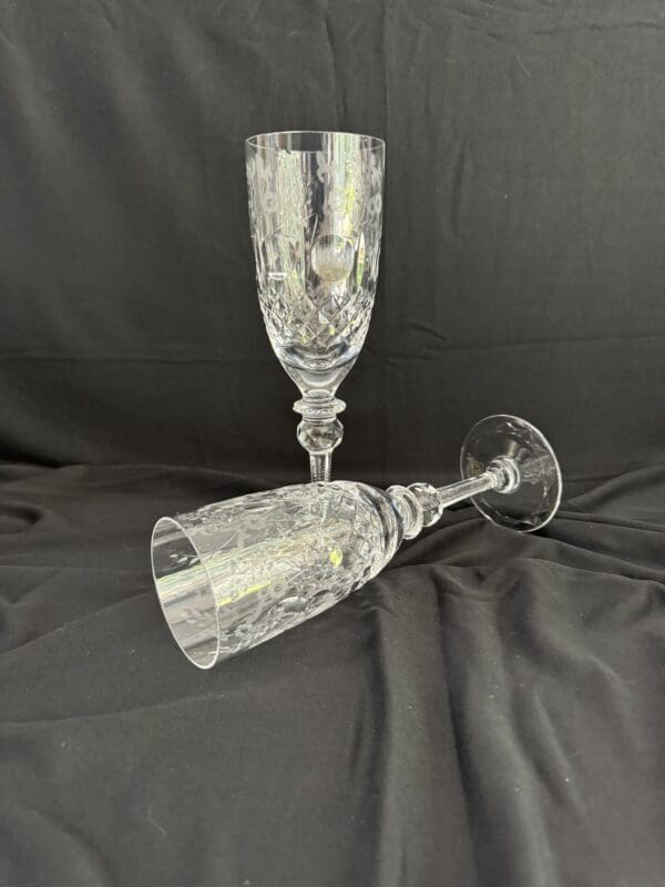 A pair of wine glasses sitting on top of a table.