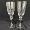 A pair of wine glasses with a floral design.
