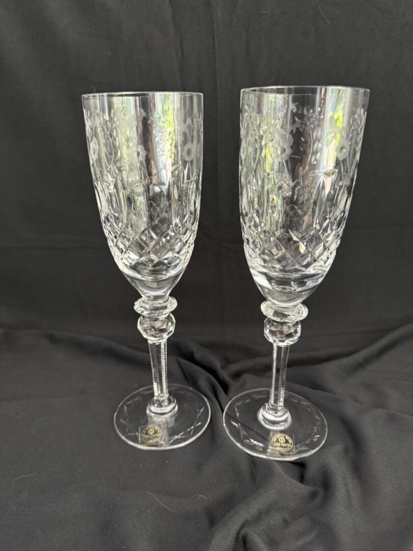 A pair of wine glasses with a floral design.