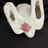 A white cup with a red tag on it.