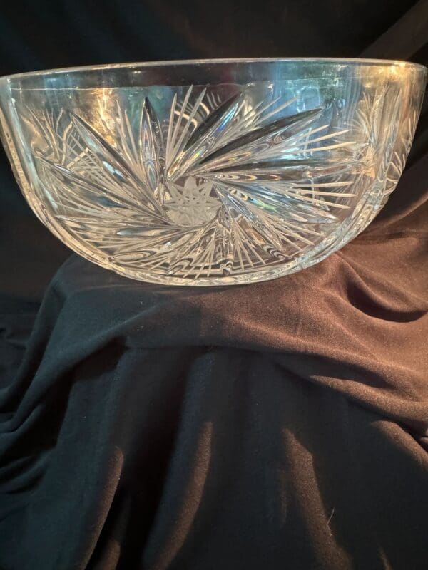 A glass bowl sitting on top of a table.