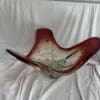 A glass bowl sitting on top of a white table.