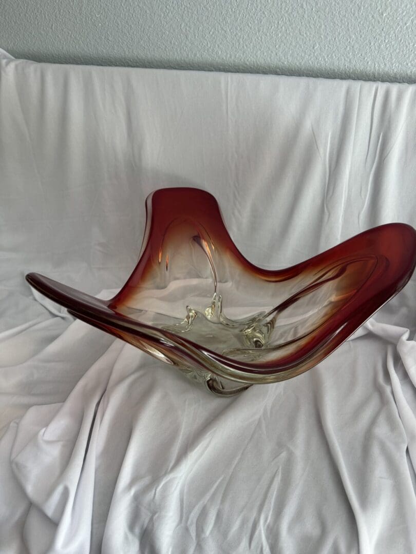 A glass bowl sitting on top of a white table.