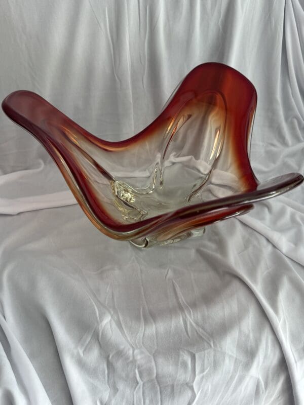 A glass bowl sitting on top of a white cloth.