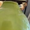 A close up of the top of a vase