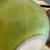 A close up of the bowl on top of the table