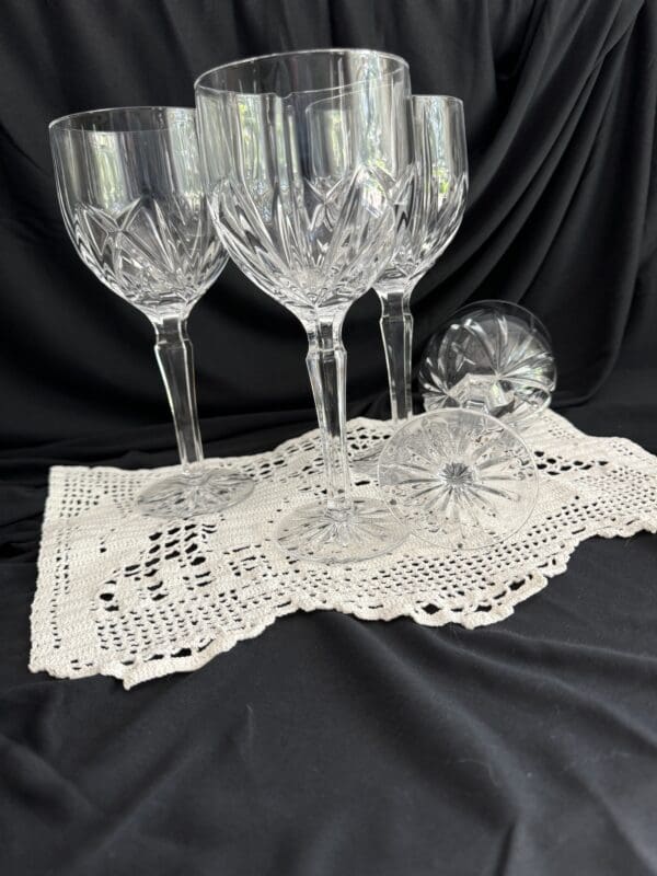 A group of wine glasses sitting on top of a table.