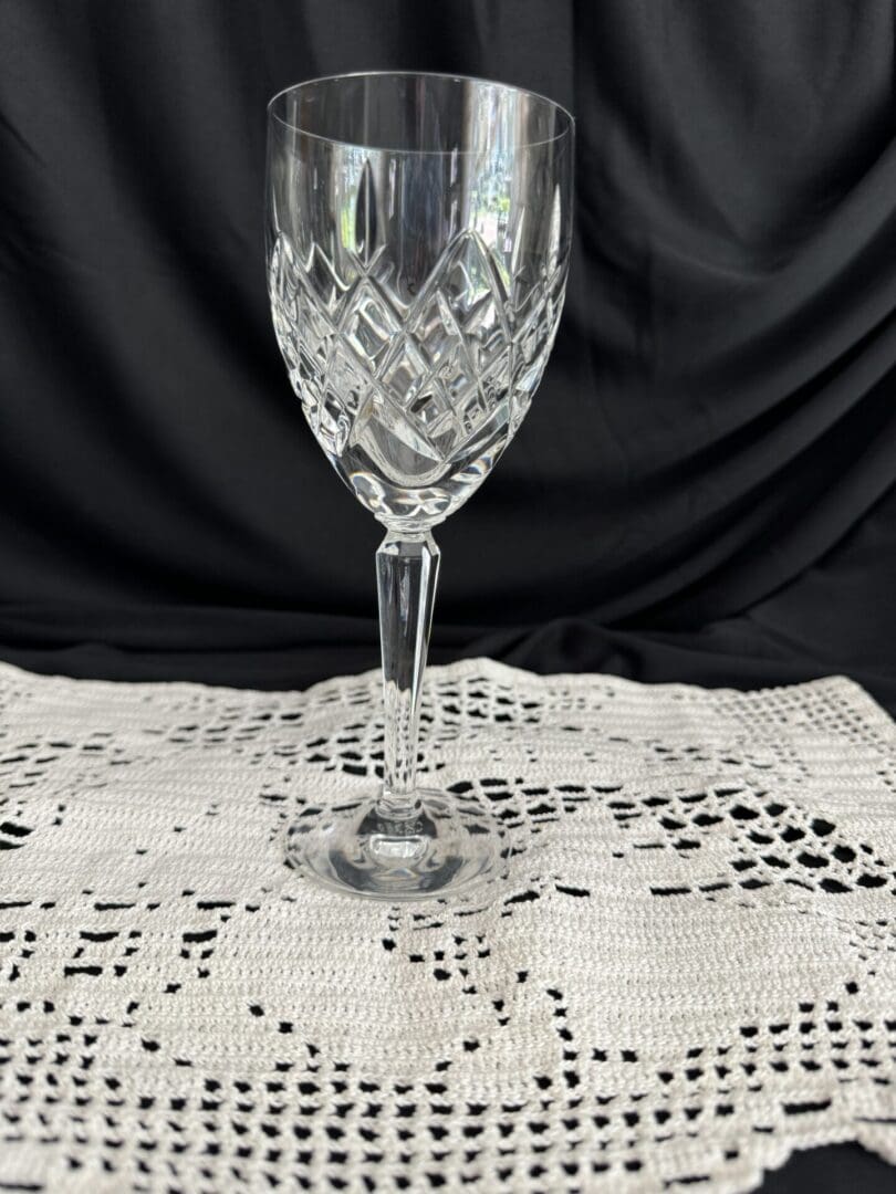 A wine glass sitting on top of a table.