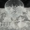 A glass bowl sitting on top of a table.