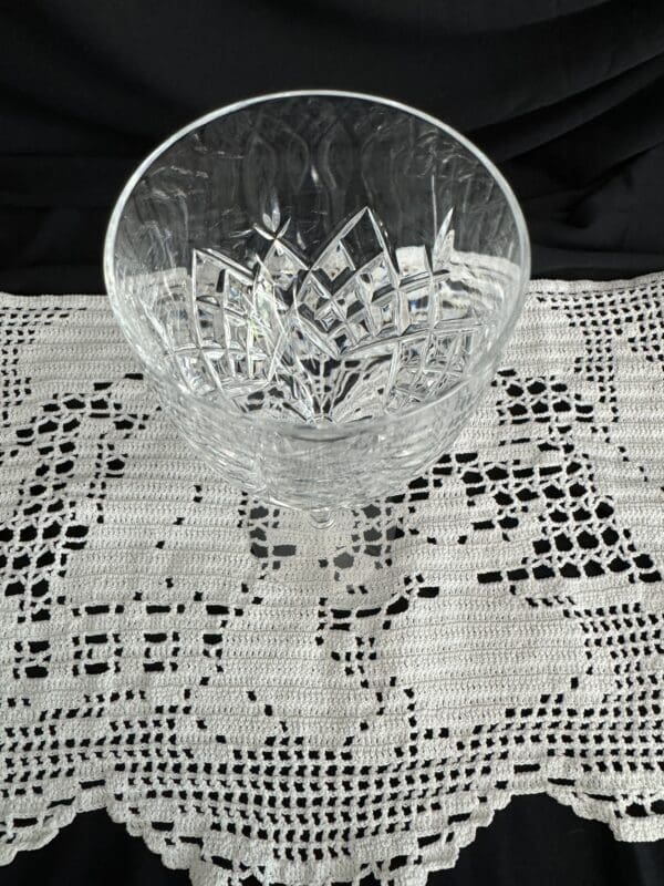 A glass bowl sitting on top of a table.