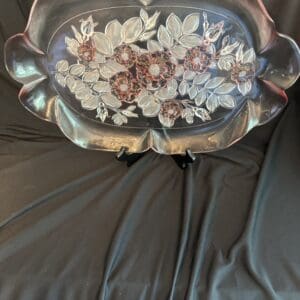 A silver tray with flowers on it