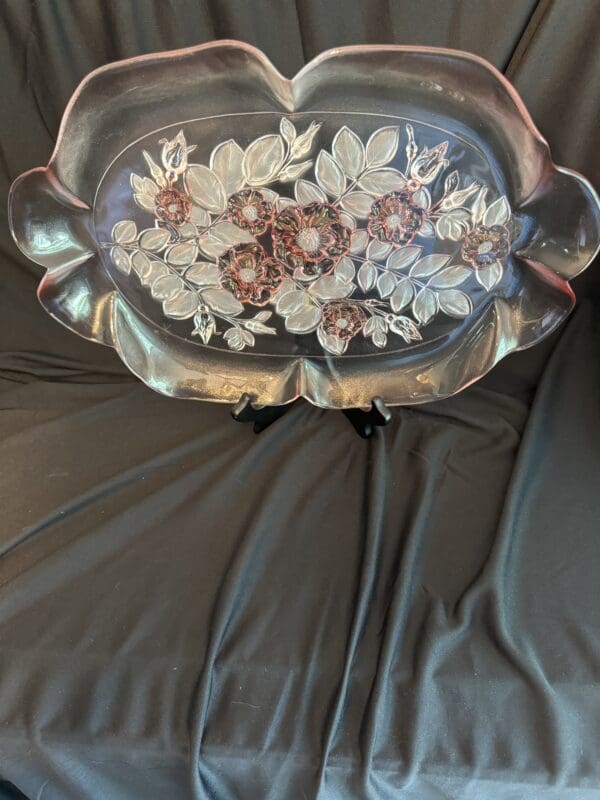 A silver tray with flowers on it