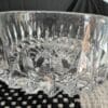 A glass bowl sitting on top of a table.