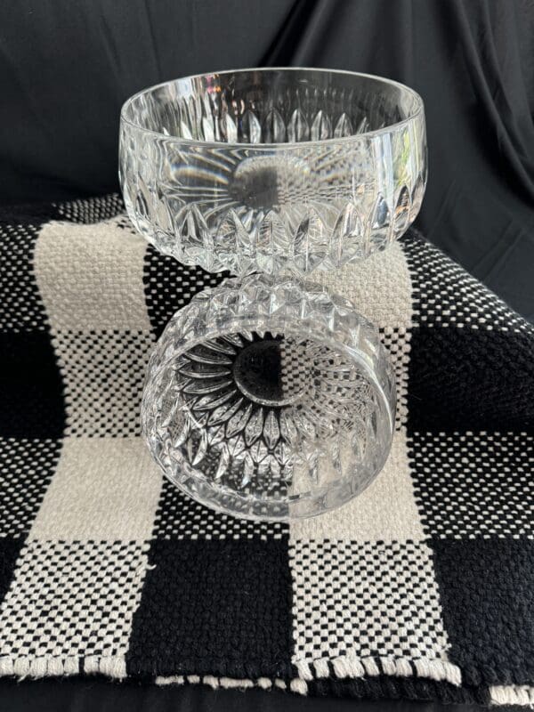 A close up of two glass bowls on top of a table