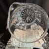 A glass bowl sitting on top of a table.