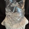 A glass vase sitting on top of a table.