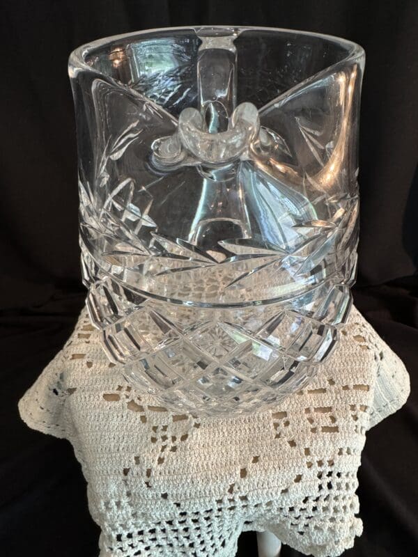 A glass vase sitting on top of a table.