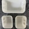 A white container with two smaller ones and one larger one.