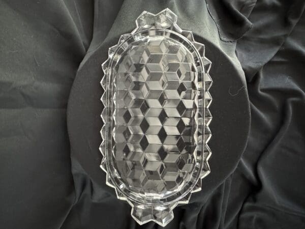 A glass dish with a pattern on it