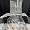A glass vase sitting on top of a table.