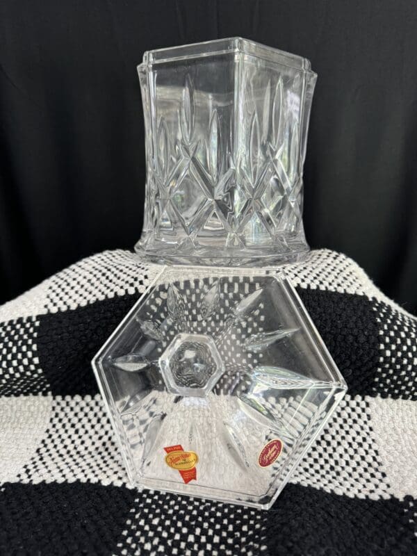 A glass vase sitting on top of a table.