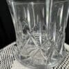 A glass vase sitting on top of a table.