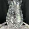 A close up of a glass vase on top of a table