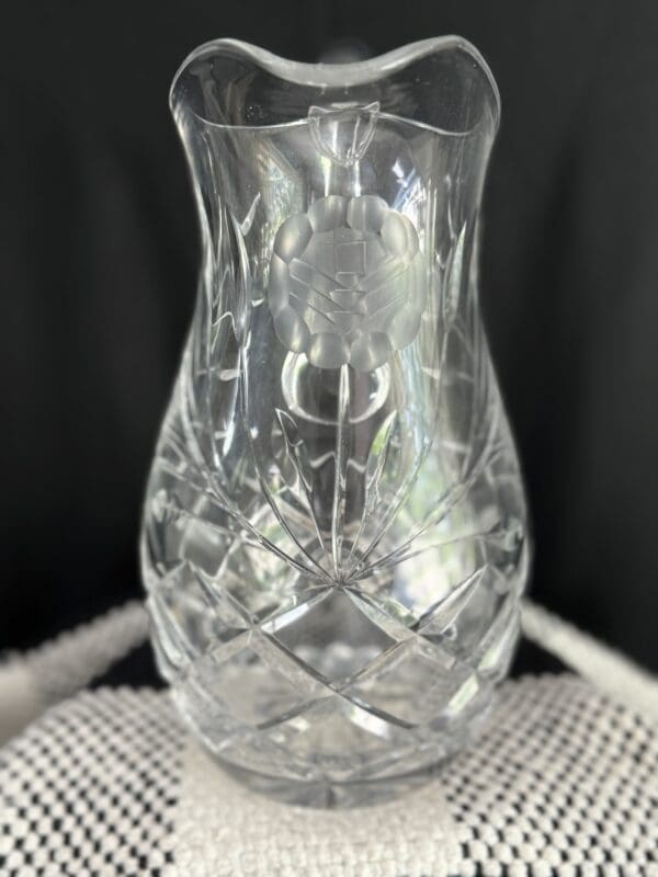 A close up of a glass vase on top of a table