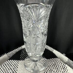 A clear glass vase sitting on top of a table.