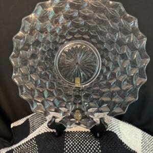 Clear decorative glass plate on display.
