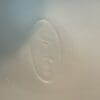 Faded imprint of the word "Jento"