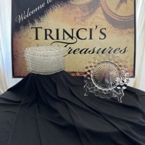 Sign for Trinci's Treasures with crystal dishes.